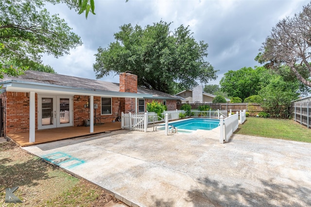 3242 Whitewing Way, Abilene, TX 79606 - view of pool with french doors, a fenced backyard, a patio, and a wooden deck