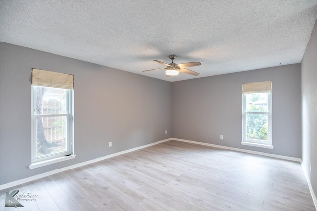 3242 Whitewing Way, Abilene, TX 79606 - empty room featuring ceiling fan, light wood-style floors, a textured ceiling, and baseboards