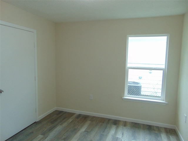 7928 Hull Ave, Dallas, TX 75216 - empty room with wood finished floors and baseboards