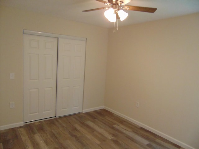 7928 Hull Ave, Dallas, TX 75216 - unfurnished bedroom with wood finished floors, baseboards, and a closet