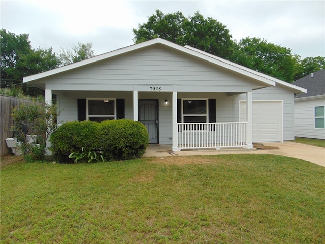 7928 Hull Ave, Dallas, TX 75216 - view of front of house with covered porch, concrete driveway, a garage, and a front yard
