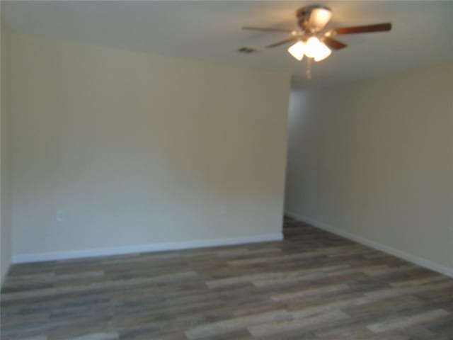 7928 Hull Ave, Dallas, TX 75216 - spare room featuring a ceiling fan, wood finished floors, and baseboards