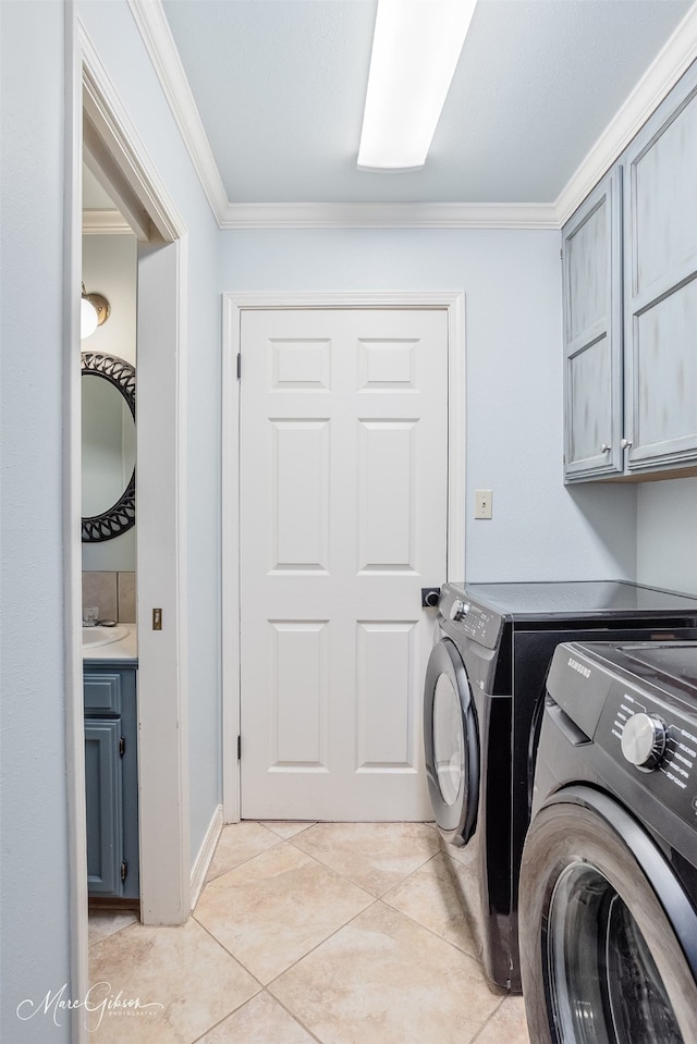 102 Pinehurst Pl, Benton, LA 71006 - clothes washing area with cabinet space, separate washer and dryer, ornamental molding, and light tile patterned floors