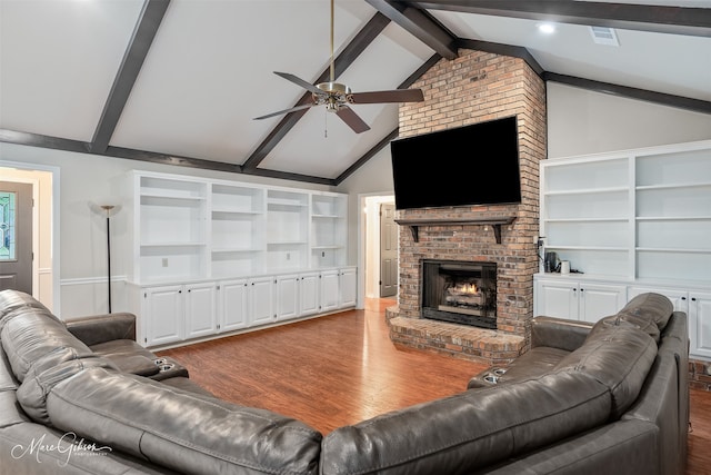 102 Pinehurst Pl, Benton, LA 71006 - living room with wood finished floors, a ceiling fan, and a brick fireplace