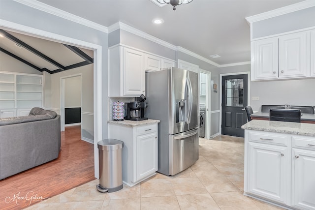 102 Pinehurst Pl, Benton, LA 71006 - kitchen featuring stainless steel fridge with ice dispenser, white cabinets, ornamental molding, lofted ceiling, and light stone countertops