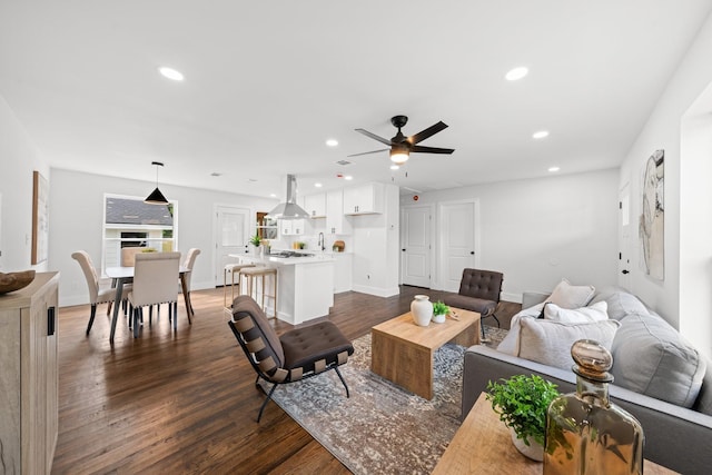 10430 Wood Dale Dr, Dallas, TX 75228 - living room with ceiling fan, recessed lighting, dark wood-style flooring, and baseboards