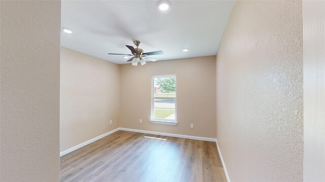 3201 Lakeland St, Fort Worth, TX 76111 - spare room featuring light wood-type flooring, a ceiling fan, baseboards, a textured wall, and recessed lighting