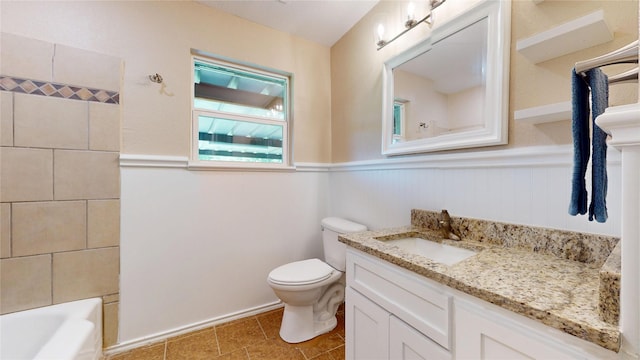 3201 Lakeland St, Fort Worth, TX 76111 - bathroom with vanity, a wainscoted wall, toilet, and tile patterned floors