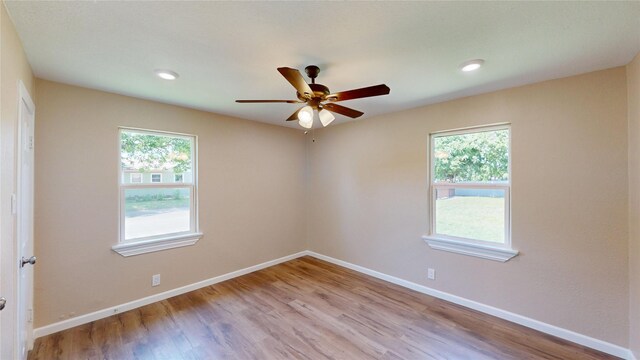 3201 Lakeland St, Fort Worth, TX 76111 - spare room featuring healthy amount of natural light, ceiling fan, baseboards, light wood finished floors, and recessed lighting