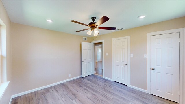 3201 Lakeland St, Fort Worth, TX 76111 - unfurnished bedroom featuring light wood finished floors, baseboards, a ceiling fan, and recessed lighting