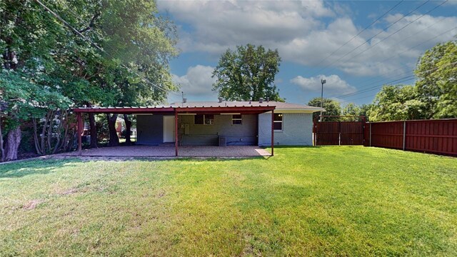 3201 Lakeland St, Fort Worth, TX 76111 - back of house with a patio area and brick siding