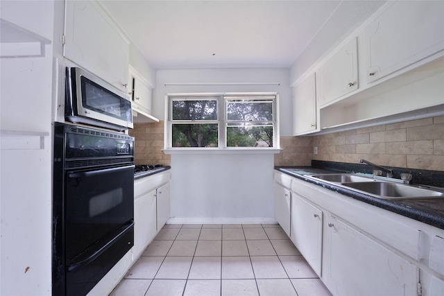8820 Easley St, White Settlement, TX 76108 - kitchen with stainless steel microwave, a sink, oven, and dark countertops