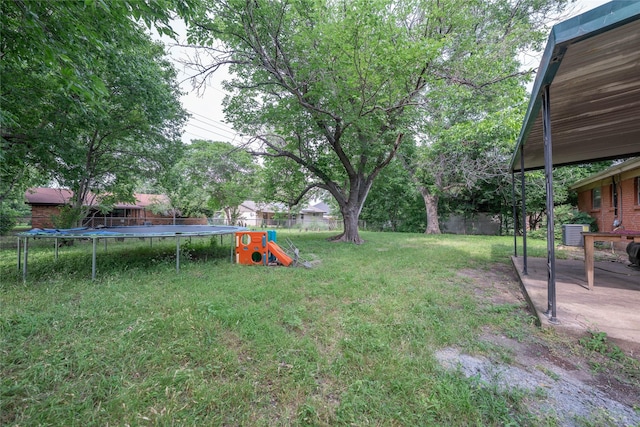 8820 Easley St, White Settlement, TX 76108 - view of yard featuring a trampoline, a patio area, and cooling unit