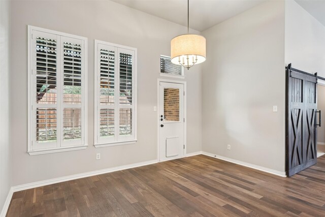 424 Sagewood Ct, Keller, TX 76248 - entrance foyer with a barn door, baseboards, wood finished floors, and a chandelier
