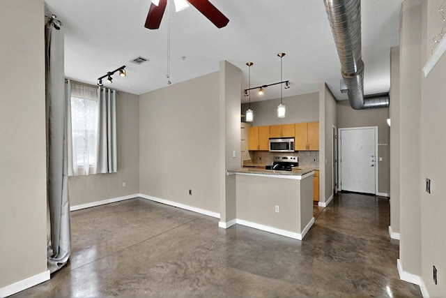 201 W Lancaster Ave Unit 218, Fort Worth, TX 76102 - kitchen featuring stainless steel microwave, electric stove, concrete floors, and track lighting
