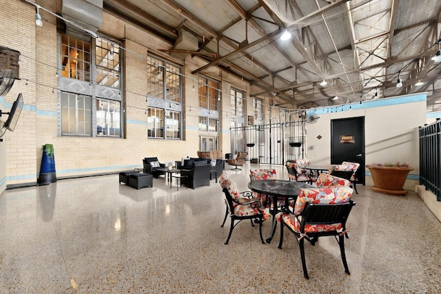 201 W Lancaster Ave Unit 218, Fort Worth, TX 76102 - dining room featuring a high ceiling and speckle patterned floor