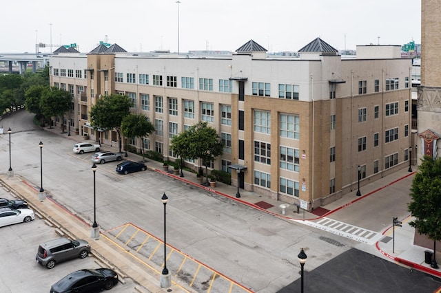 201 W Lancaster Ave Unit 218, Fort Worth, TX 76102 - view of building exterior with uncovered parking