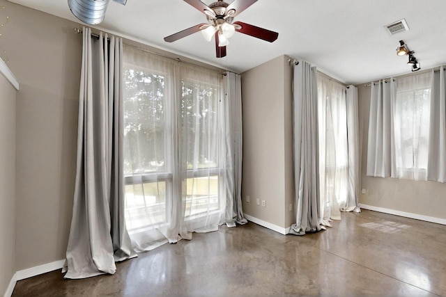 201 W Lancaster Ave Unit 218, Fort Worth, TX 76102 - unfurnished room with baseboards, concrete flooring, and a ceiling fan