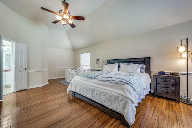 bedroom featuring wood finished floors, high vaulted ceiling, baseboards, and a ceiling fan