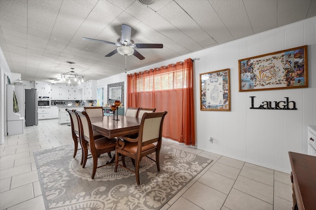 4900 Ira St, Haltom City, TX 76117 - dining space featuring a ceiling fan and light tile patterned floors