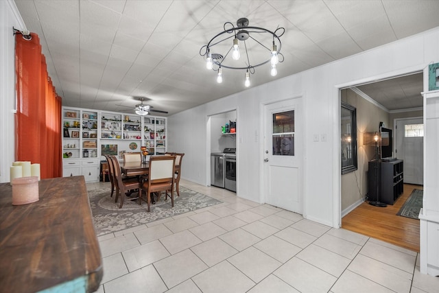 4900 Ira St, Haltom City, TX 76117 - dining space featuring a ceiling fan, ornamental molding, light tile patterned flooring, and built in features