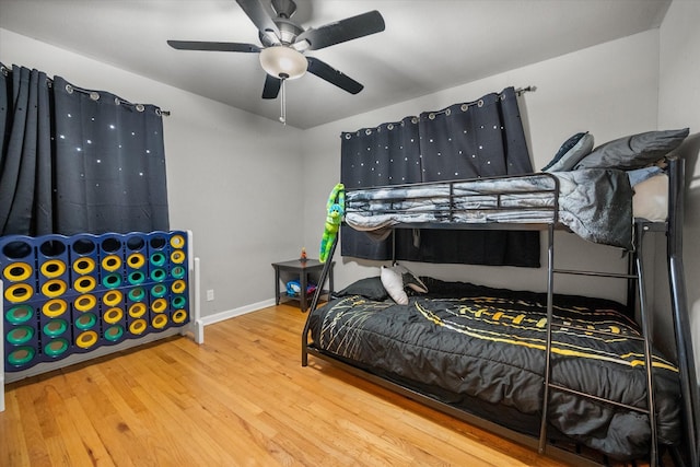 4900 Ira St, Haltom City, TX 76117 - bedroom with wood finished floors, baseboards, and ceiling fan