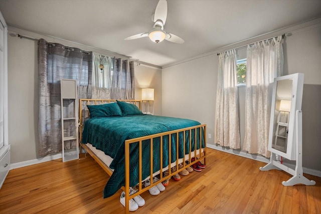 4900 Ira St, Haltom City, TX 76117 - bedroom with baseboards, wood finished floors, ceiling fan, and ornamental molding