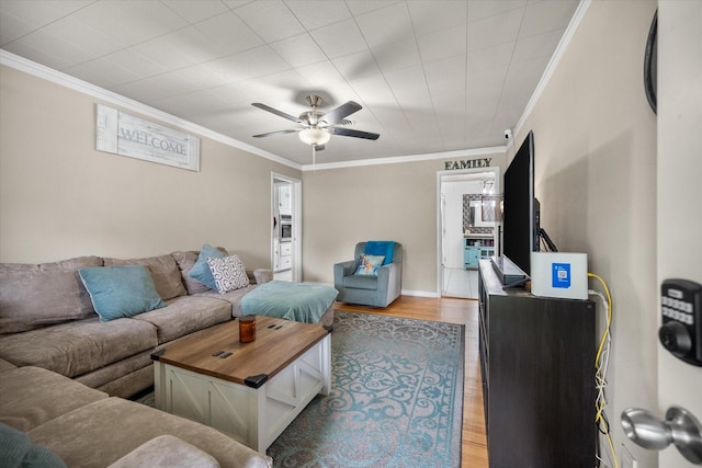4900 Ira St, Haltom City, TX 76117 - living area featuring ceiling fan, ornamental molding, and light wood-style flooring