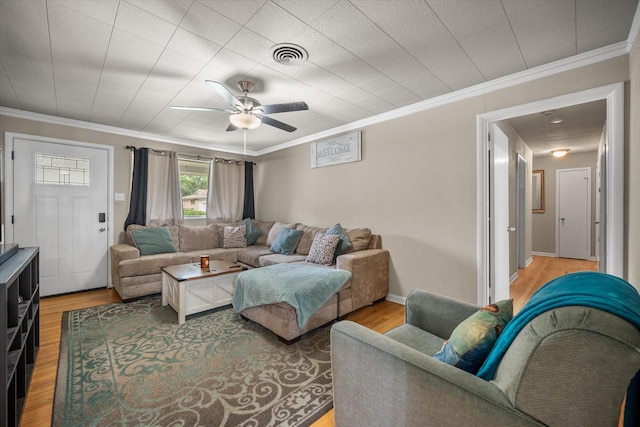 4900 Ira St, Haltom City, TX 76117 - living area featuring ceiling fan, light wood-style floors, and crown molding