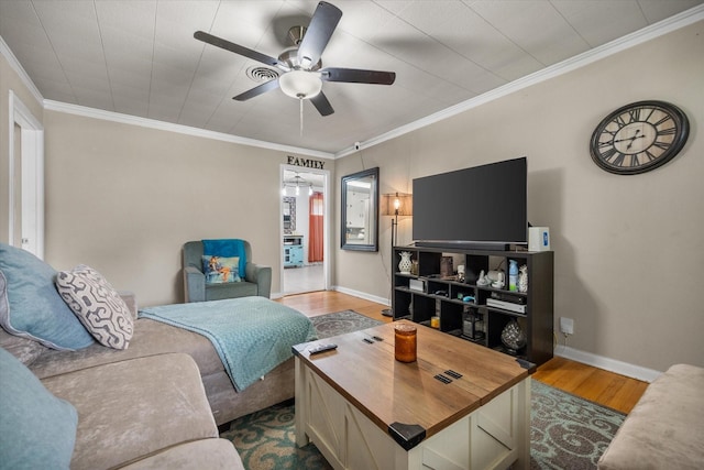 4900 Ira St, Haltom City, TX 76117 - living room featuring wood finished floors, ceiling fan, crown molding, and baseboards