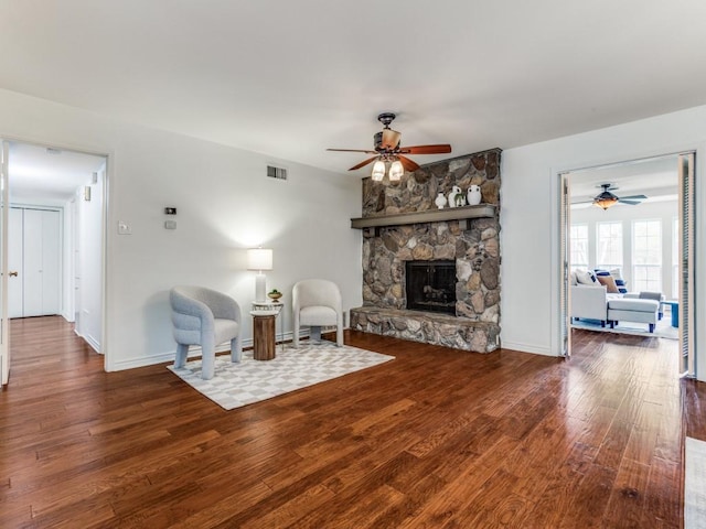 827 Sherbrook Dr, Richardson, TX 75080 - living area featuring a ceiling fan, wood finished floors, a fireplace, and baseboards