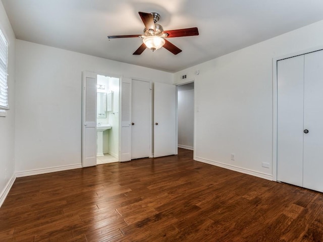 827 Sherbrook Dr, Richardson, TX 75080 - unfurnished bedroom with wood finished floors, baseboards, ensuite bath, and a ceiling fan