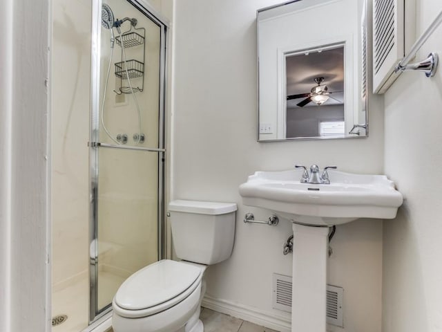 827 Sherbrook Dr, Richardson, TX 75080 - bathroom with toilet, a stall shower, tile patterned floors, and baseboards