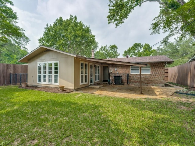 827 Sherbrook Dr, Richardson, TX 75080 - rear view of house with a patio area, brick siding, and central AC