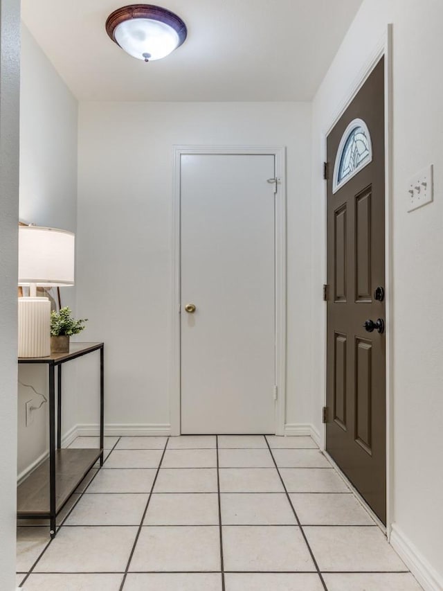 827 Sherbrook Dr, Richardson, TX 75080 - entryway with light tile patterned floors and baseboards