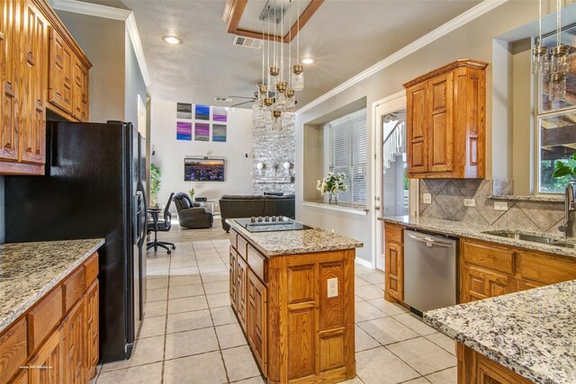 930 Lakeridge Dr, Lavon, TX 75166 - kitchen featuring stainless steel dishwasher, a sink, black fridge with ice dispenser, brown cabinets, and ornamental molding