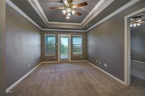 930 Lakeridge Dr, Lavon, TX 75166 - carpeted spare room with a tray ceiling, crown molding, baseboards, and ceiling fan