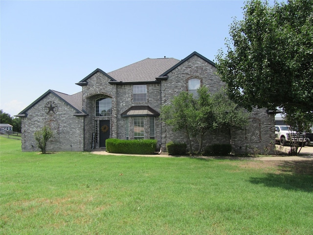 930 Lakeridge Dr, Lavon, TX 75166 - french provincial home featuring a front lawn, brick siding, and a shingled roof