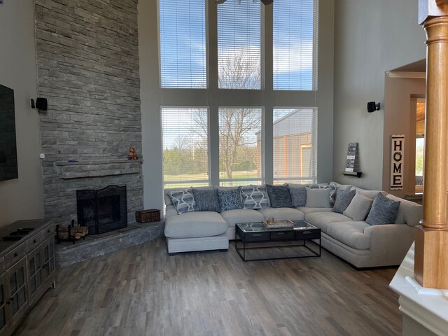 930 Lakeridge Dr, Lavon, TX 75166 - living room with a high ceiling, a stone fireplace, and wood finished floors