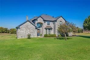 930 Lakeridge Dr, Lavon, TX 75166 - french provincial home with a front yard, stone siding, and a chimney