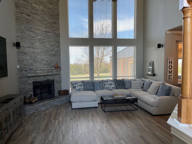 930 Lakeridge Dr, Lavon, TX 75166 - living room with a high ceiling, a stone fireplace, and wood finished floors