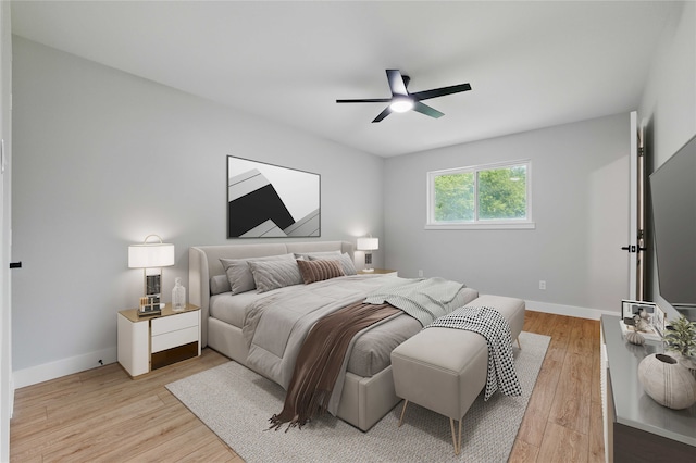 742 Chalk Hill Ln, Desoto, TX 75115 - bedroom with light wood-style flooring, baseboards, and a ceiling fan