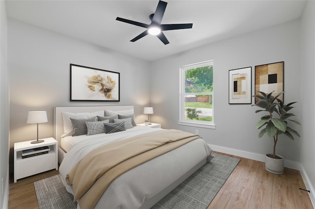 742 Chalk Hill Ln, Desoto, TX 75115 - bedroom with baseboards, wood finished floors, and a ceiling fan