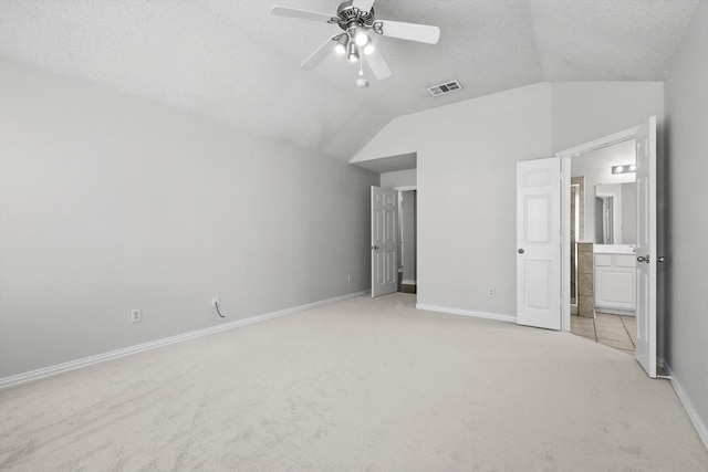8100 Hosta Way, Fort Worth, TX 76123 - unfurnished bedroom featuring lofted ceiling, carpet flooring, ensuite bathroom, baseboards, and a textured ceiling