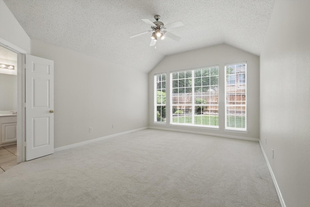 8100 Hosta Way, Fort Worth, TX 76123 - unfurnished bedroom with light colored carpet, a textured ceiling, baseboards, lofted ceiling, and ceiling fan