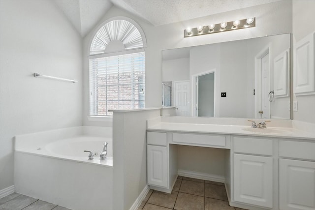 8100 Hosta Way, Fort Worth, TX 76123 - full bath featuring tile patterned flooring, a bath, vanity, lofted ceiling, and baseboards