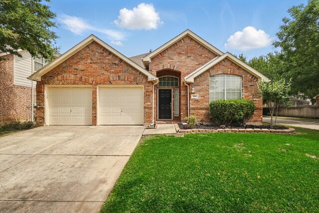 8100 Hosta Way, Fort Worth, TX 76123 - view of front facade with an attached garage, brick siding, a front lawn, and concrete driveway