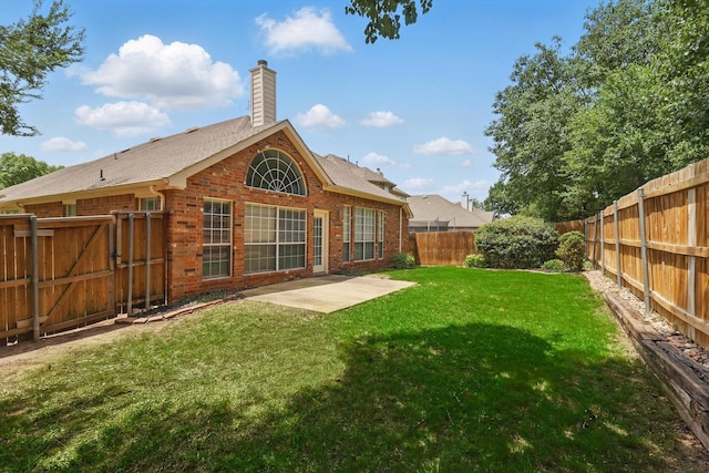 8100 Hosta Way, Fort Worth, TX 76123 - rear view of house featuring brick siding, a chimney, a patio, and a gate