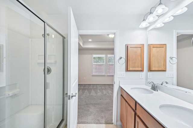 7789 Gulf Breeze Ln, Frisco, TX 75036 - full bath with a shower stall, double vanity, baseboards, and a raised ceiling