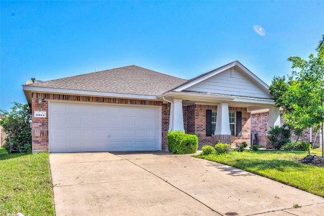 2144 Callahan Dr, Forney, TX 75126 - view of front of house featuring brick siding, concrete driveway, a garage, and a front yard